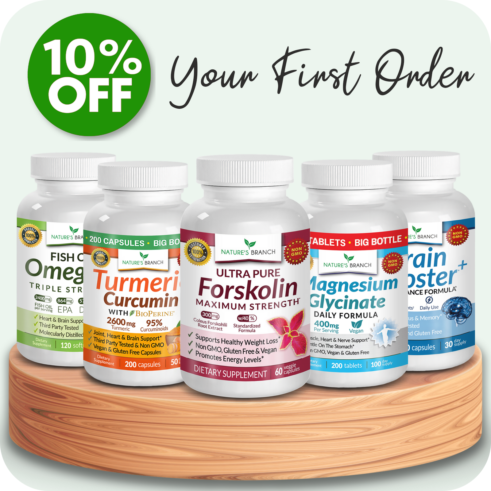 Natures Branch Omega 3 Fish Oil, Turmeric Curcumin, Forskolin, Magnesium Glycinate and Brain Booster bottles on a round wooden platform with a green background