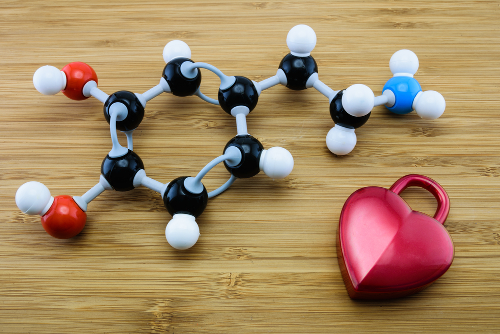 a molecule model and a heart shaped object